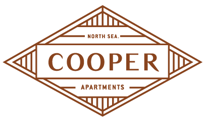 A logo for Cooper Apartments in the North East.